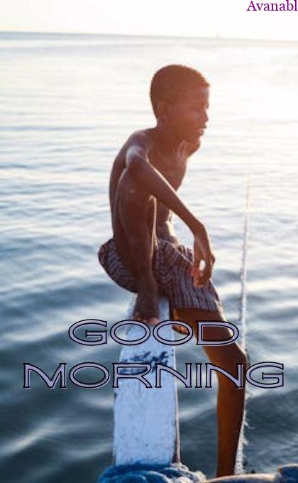 man sitting near river morning wishes